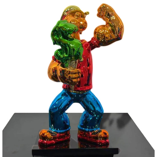 Gouden beeld van Popeye met een rood shirt en groen dollar ijsje
